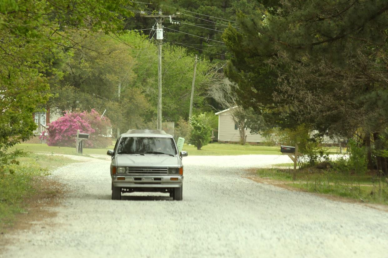 Traffic comes down Arvida Spur Road Tuesday April 12, 2022 in Rocky Point, N.C. Neighbors are concerned about terrible road conditions of the Arvida neighborhood.