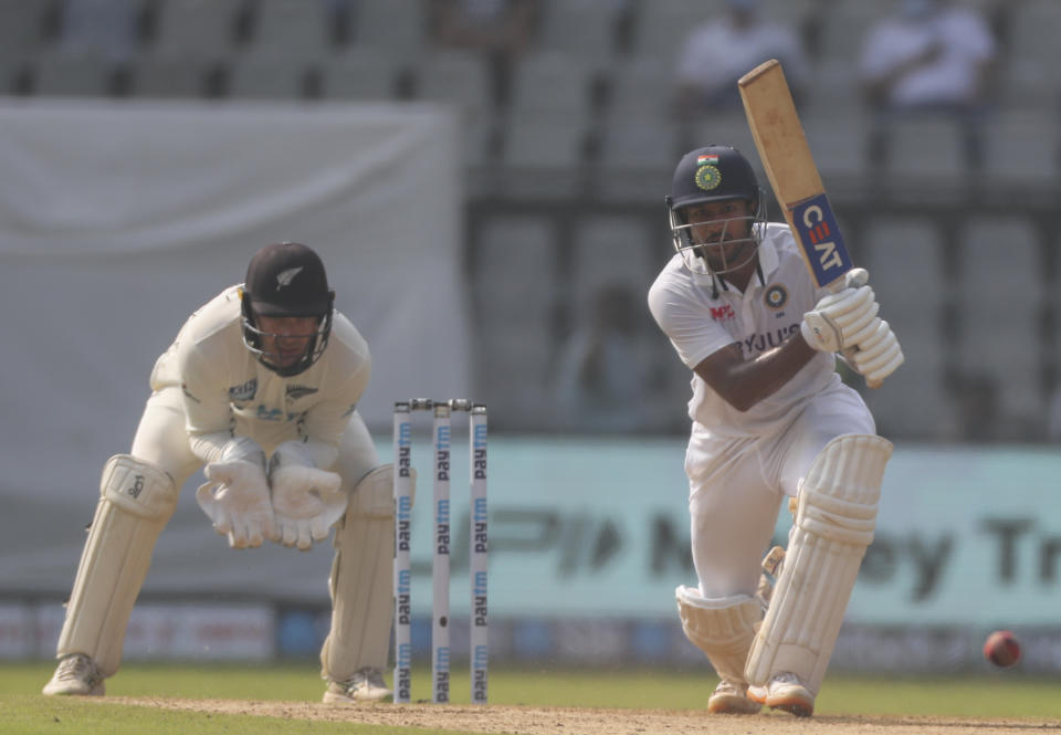 India's Mayank Agarwal plays shot during the day two of their second test cricket match with New Zealand in Mumbai, India, Saturday, Dec. 4, 2021.(AP Photo/Rafiq Maqbool)