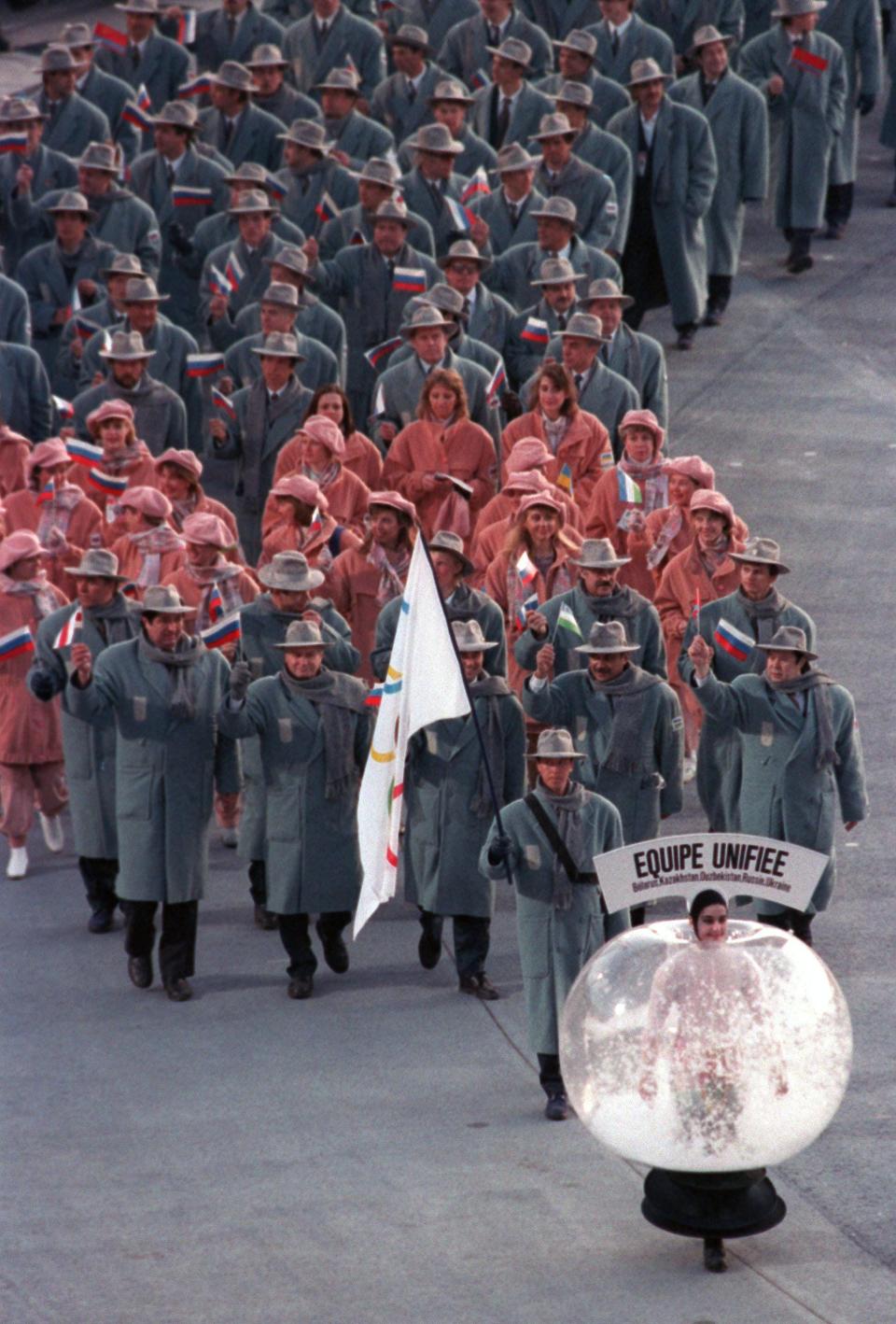 The Russian team dressed in long coats and hats at the 1992 Olympics.