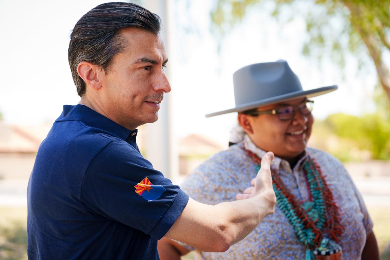 Marco Lopez, a Democratic candidate for governor, speaks to voters during a Legislative District 9 Pride event at Fitch Park in Mesa on June 11, 2022.
