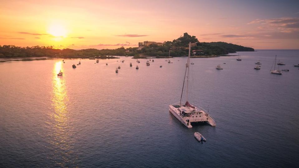 boats in the water at sunset 