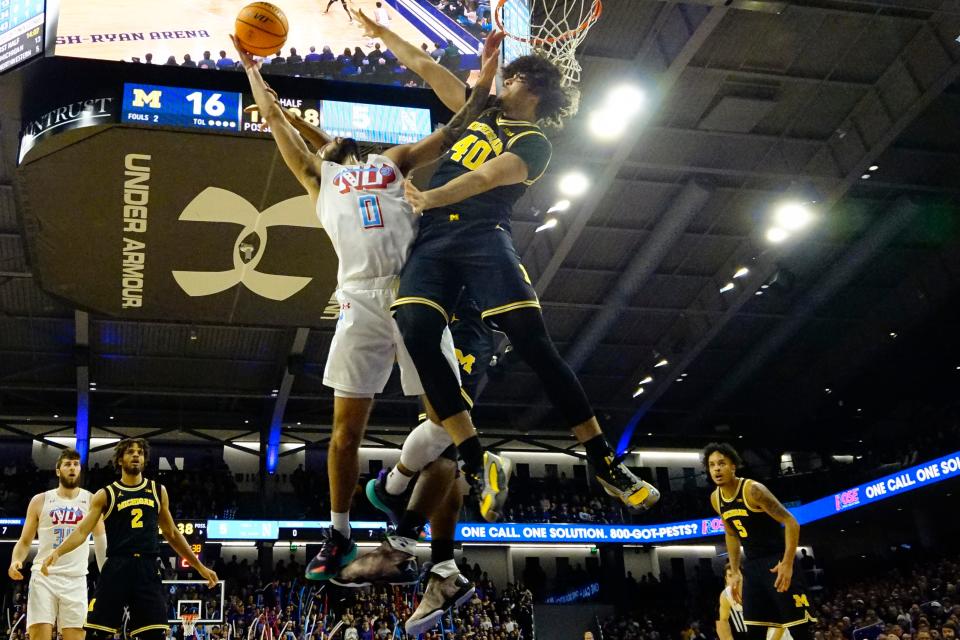 Michigan Wolverines guard George Washington III (40) defends Northwestern Wildcats guard Boo Buie (0) during the first half at Welsh-Ryan Arena in Evanston, Illinois, on Thursday, Feb. 22, 2024.