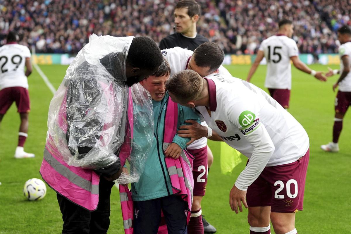 A boy was trapped under a sign and the players were desperate to help him