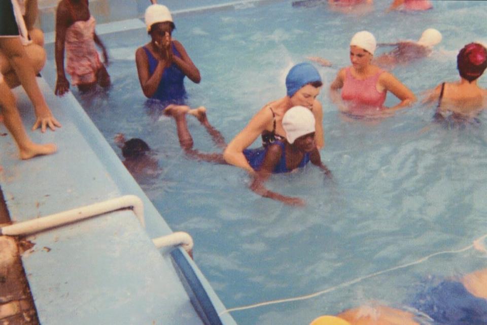 Eunice Kennedy Shriver teaching swimming lessons at Camp Shriver.