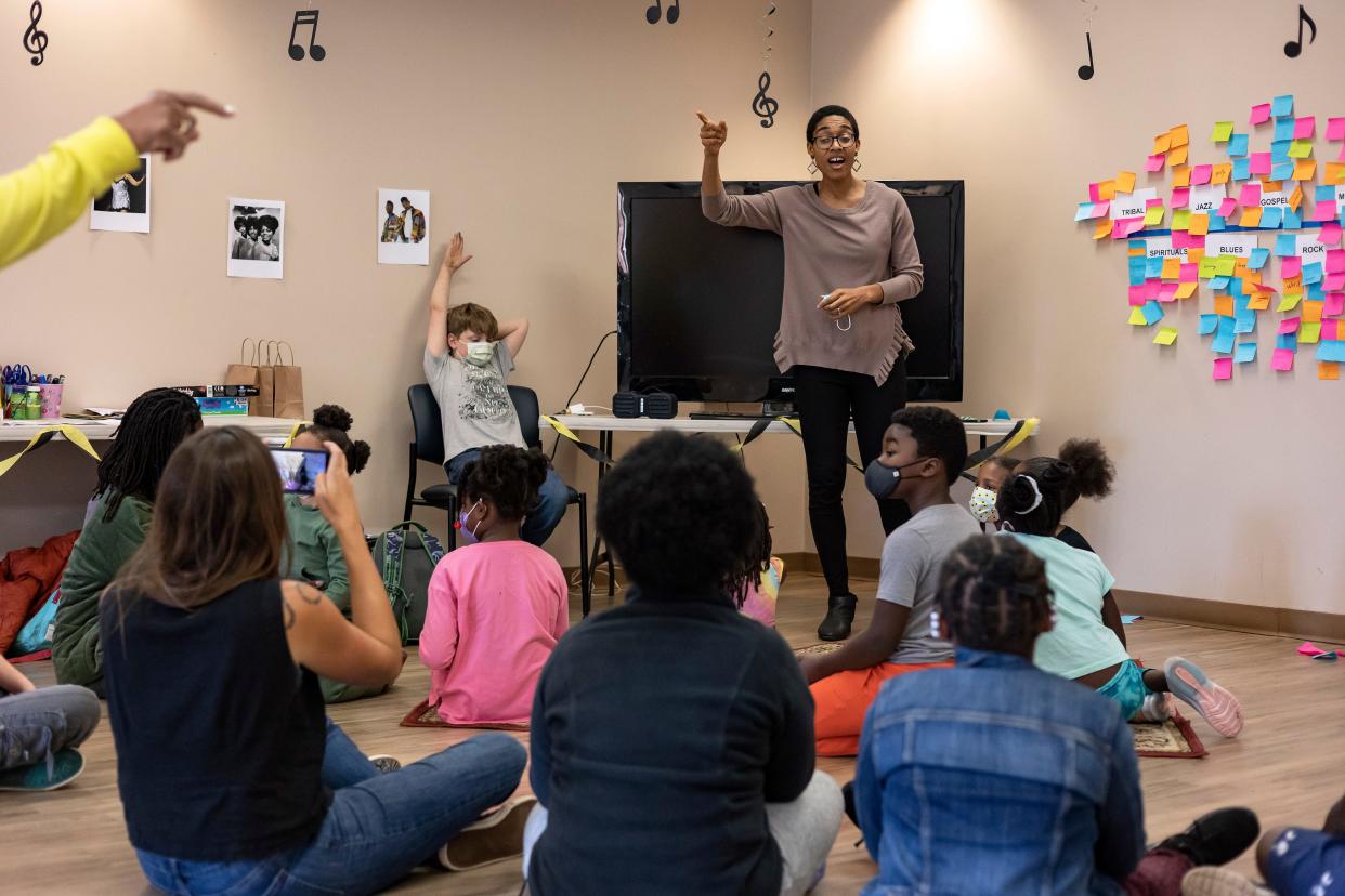 Lora Smothers leads children in a song during the first day of the two-day Joy Village School music camp on Monday, Nov. 22, 2021, in Athens. The camp, consisting of about 25 students grades K-8, featured multiple play-based learning activities with a focus on the history of Black music.