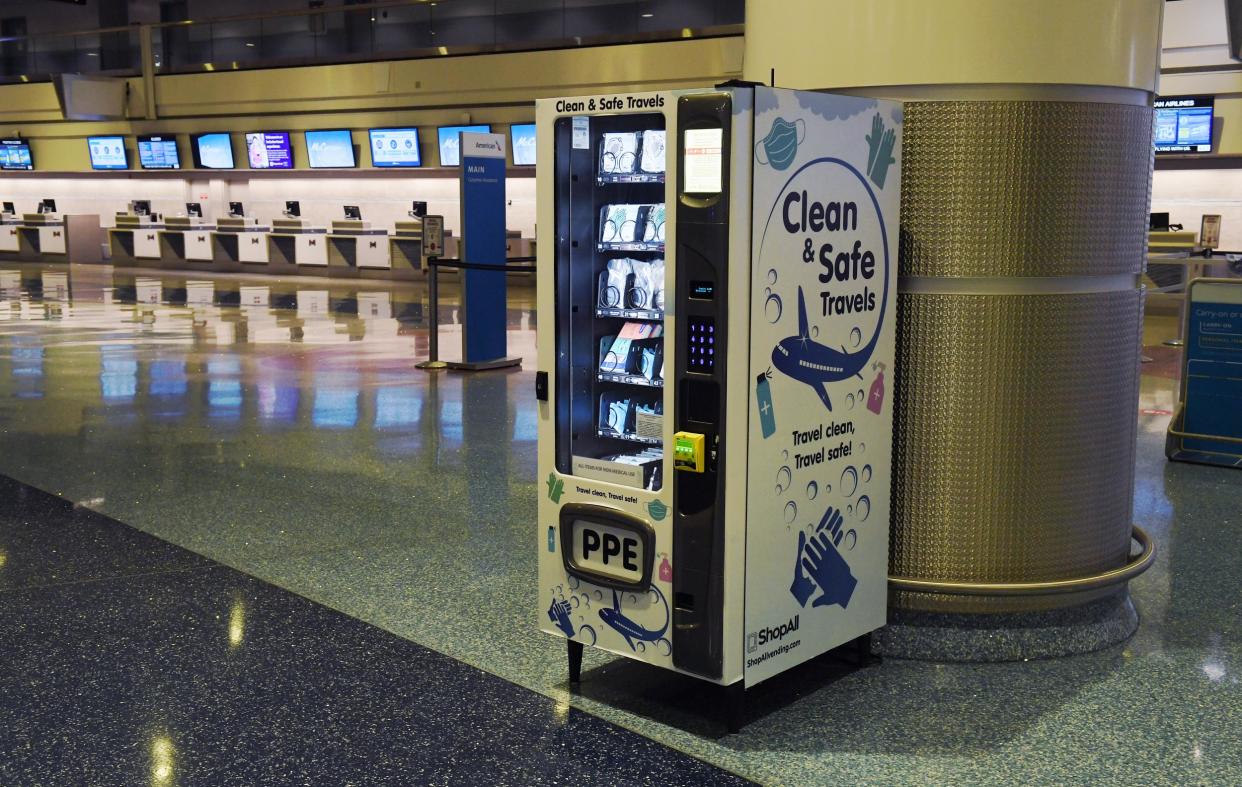 LAS VEGAS, NEVADA - MAY 14: A personal protective equipment vending machine is set up in the Terminal 1 ticketing area at McCarran International Airport on May 14, 2020 in Las Vegas, Nevada. The airport used its social media platforms on Thursday to report that it was the first to install the machines that sell items such as masks, gloves and hand sanitizer. The nation's 10th busiest airport recorded a 53% decrease in arriving and departing passengers for March compared to the same month in 2019, a drop of more than 2.3 million travelers, as the COVID-19 pandemic impacts the travel industry. (Photo by Ethan Miller/Getty Images): Getty Images