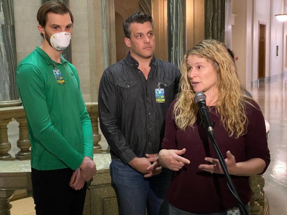 Jolene de Vries, right, and other other gym owners in Saskatchewan shared their concerns about the new six per cent PST levied on gym memberships at the legislature on Thursday.  (Kirk Fraser/CBC - image credit)