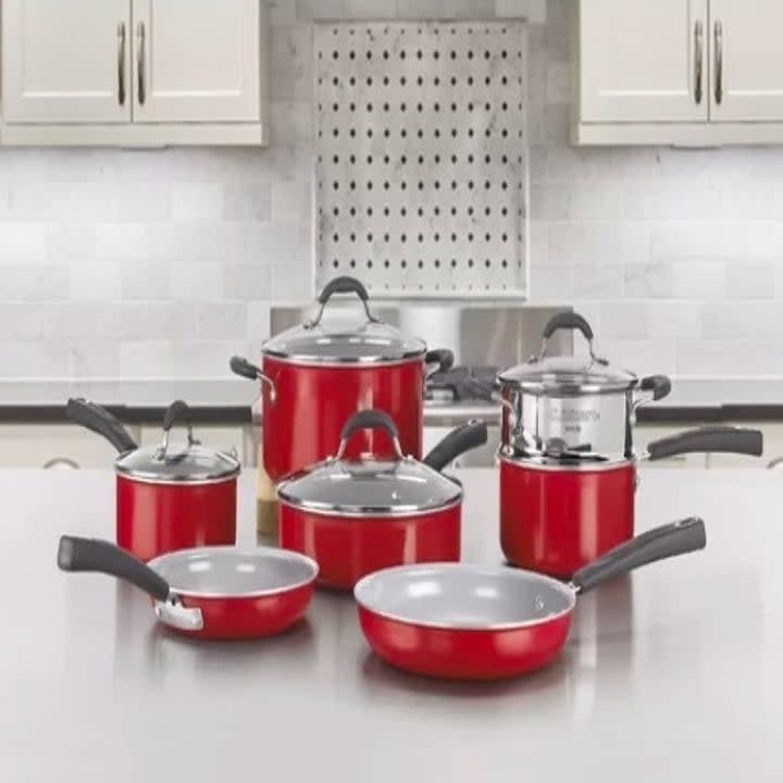 Red cookware set on a kitchen counter