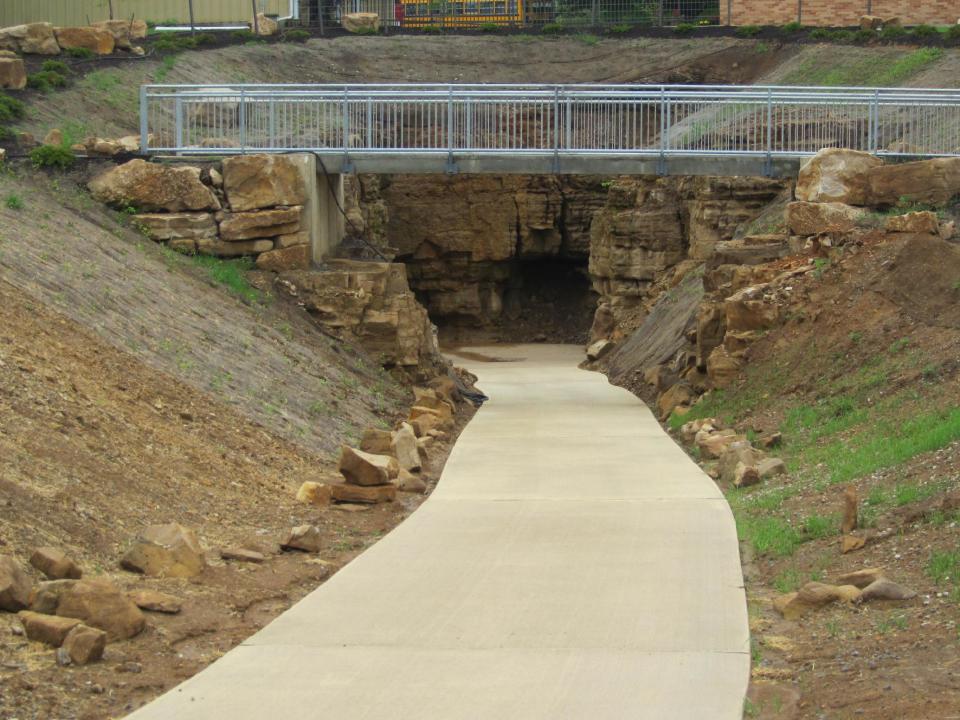 This undated photo provided by Ohio Caverns in West Liberty, Ohio, shows a new entrance that will open Memorial Day. Workers have been clearing clay since 2007 to open sections of Ohio's largest cave system unseen by the public - increasing the amount of surveyed passageways to 3-1/2 miles. (AP Photo/Ohio Caverns)