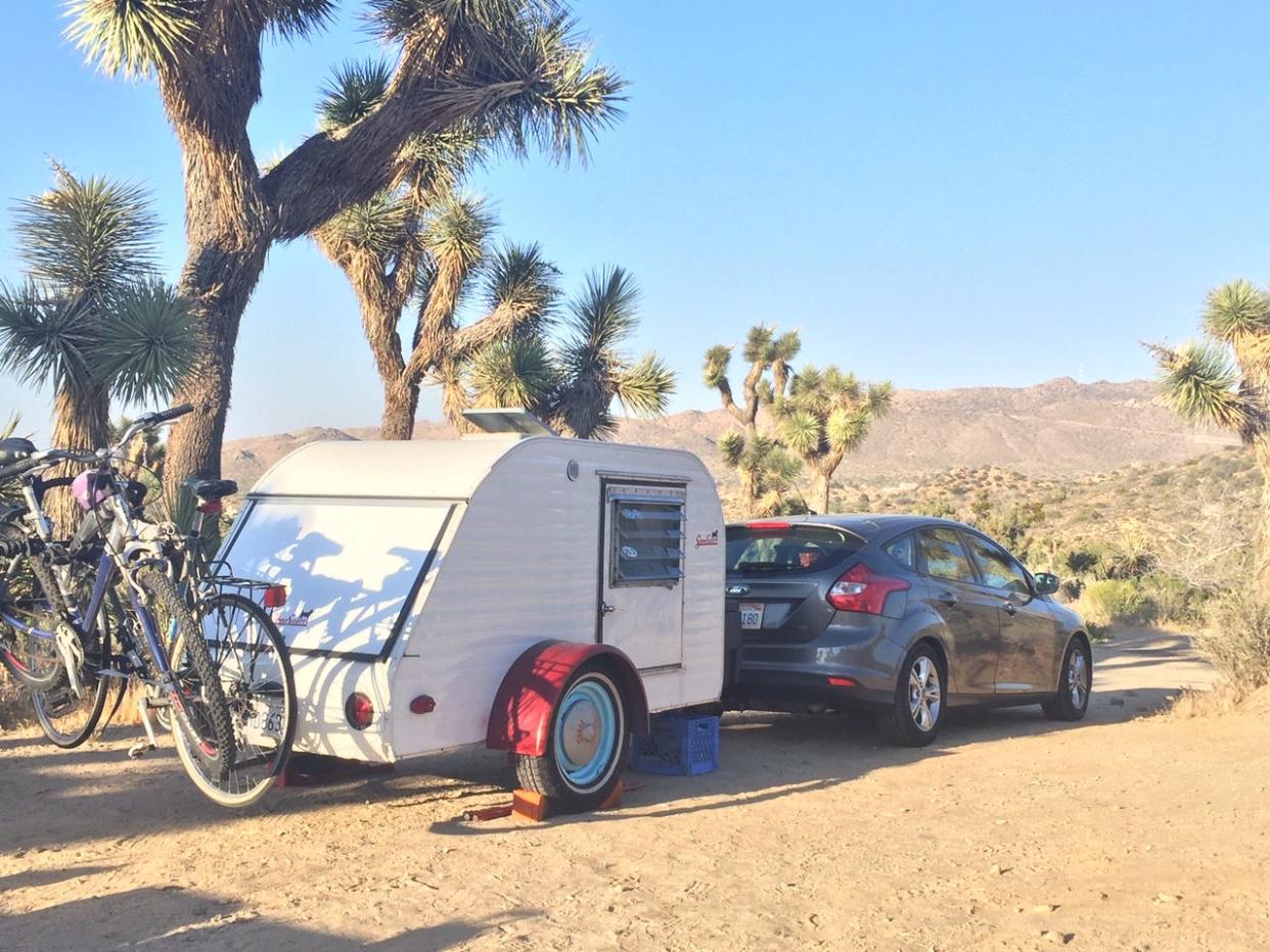 Our Napier Backroadz tent connected to our Ford SUV.