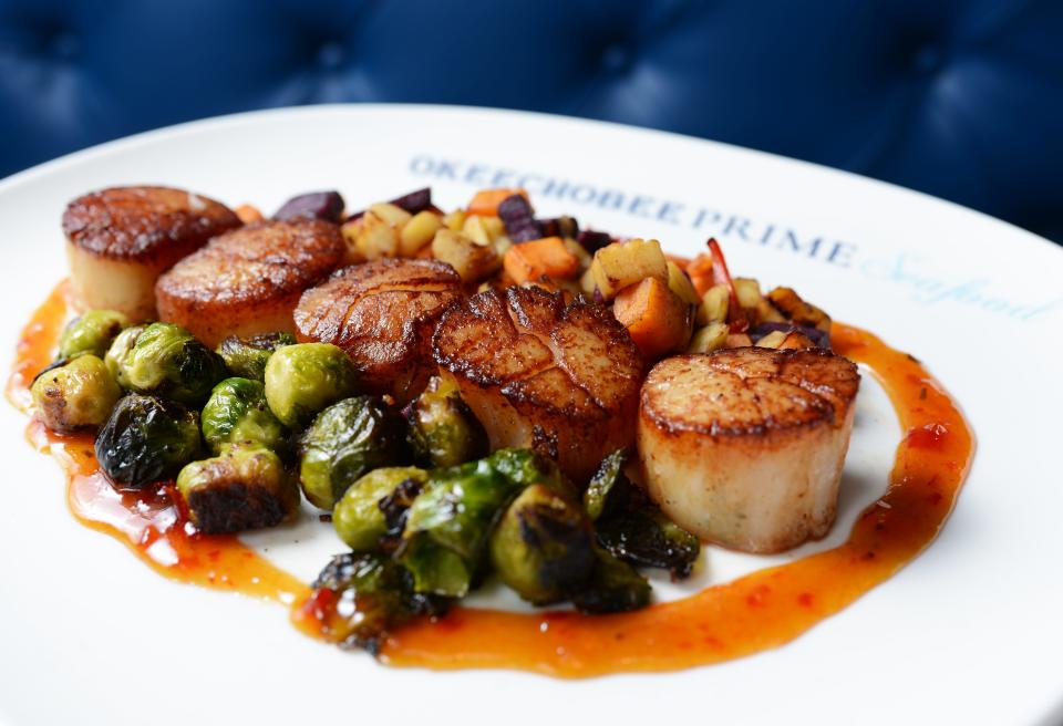 On the menu at Okeechobee Prime Seafood: pan-seared scallops with Brussels sprouts and mango gastrique. ALISSA DRAGUN