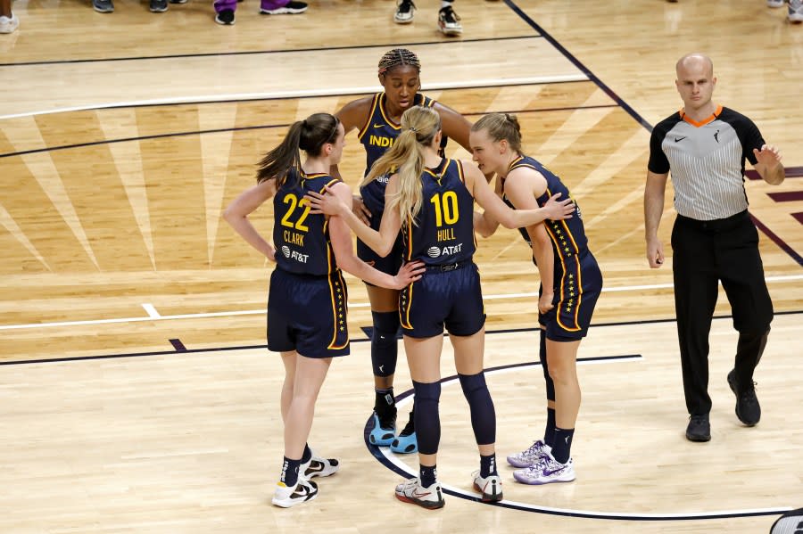 INDIANAPOLIS, IN – MAY 09: Indiana Fever guard Caitlin Clark (22) huddles up with her team while playing against the Atlanta Dream during a WNBA preseason game on May 9, 2024, at Gainbridge Fieldhouse in Indianapolis, Indiana. (Photo by Brian Spurlock/Icon Sportswire via Getty Images)