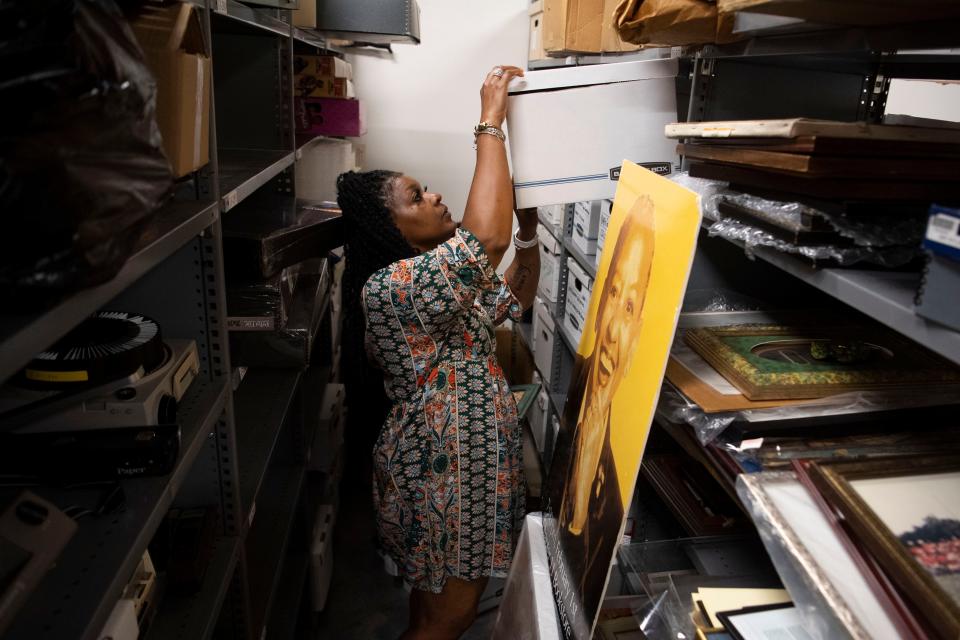 Renee Kesler, president of the Beck Cultural Exchange Center, looks through the large collection of personal and academic items donated by Nikki Giovanni.