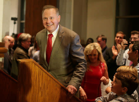 Republican candidate Roy Moore enters the stage to make his victory speech after defeating incumbent Luther Strange to his supporters at the RSA Activity center in Montgomery, Alabama, U.S. September 26, 2017, during the runoff election for the Republican nomination for Alabama's U.S. Senate seat vacated by Attorney General Jeff Sessions. REUTERS/Marvin Gentry