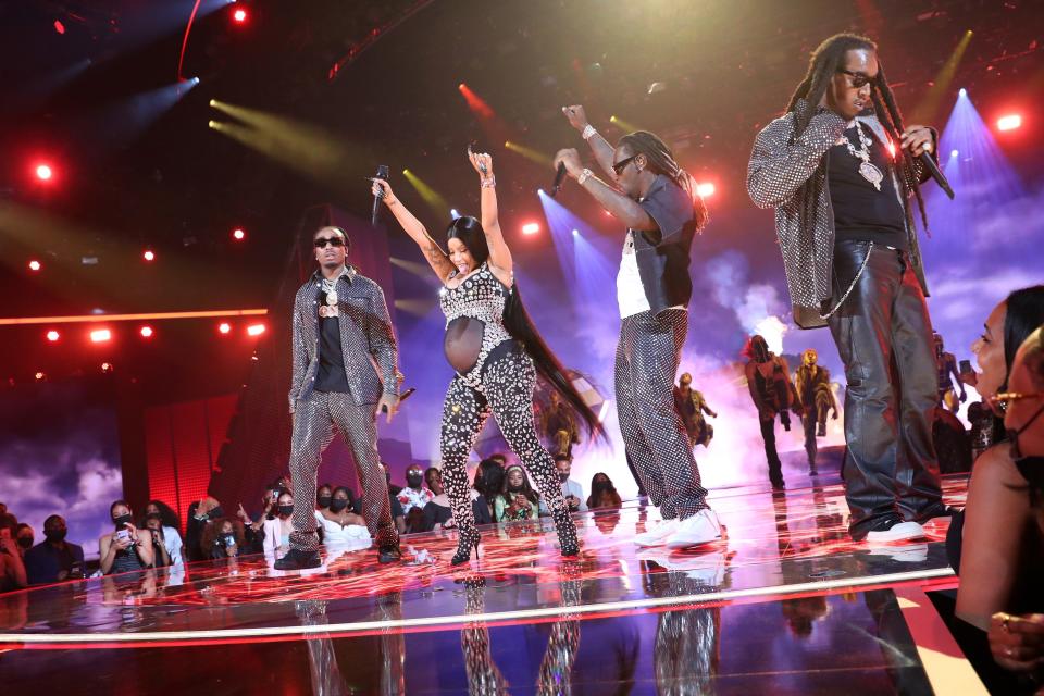 Cardi B and Quavo, Offset, and Takeoff of Migos perform onstage at the 2021 BET Awards.