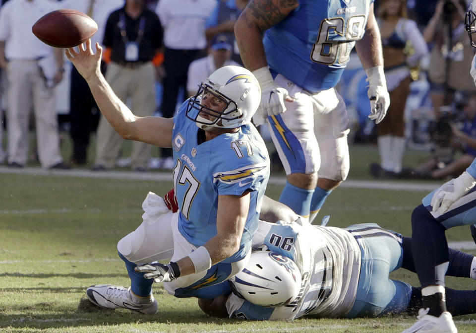 <p>San Diego Chargers quarterback Philip Rivers tries to get rid of the ball as he is hauled down by Tennessee Titans defensive end DaQuan Jones during the first half of an NFL football game Sunday, Nov. 6, 2016, in San Diego. (AP Photo/Rick Scuteri) </p>