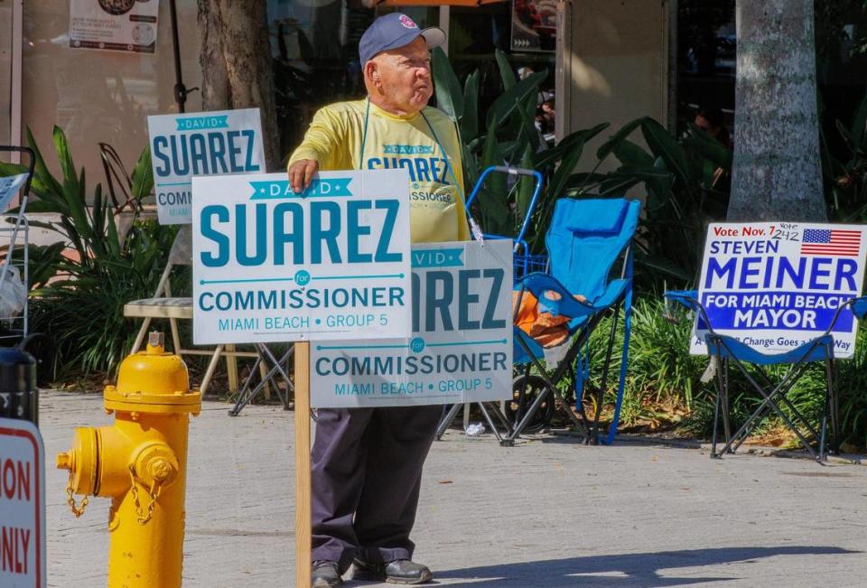 Jose Roble campaigns for commission candidate David Suarez outside of the early voting polling place at the Miami Beach City Hall, on Tuesday, October 31, 2023.