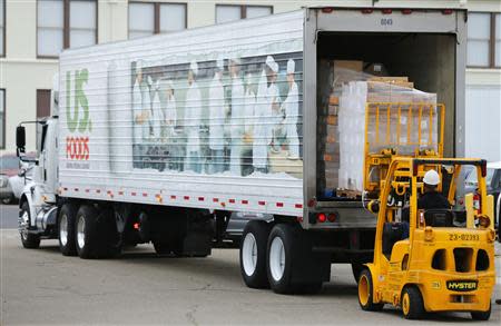 Supplies arrive before they are loaded into the San Diego-based hospital ship USNS Mercy as it prepares for possible deployment to aid the typhoon-stricken areas of the Philippines from its port in San Diego, California November 15, 2013. REUTERS/Mike Blake