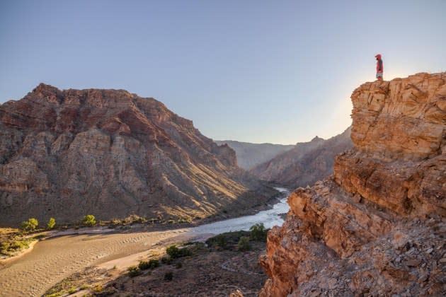 Muddy sediment flowing down the Colorado River - Credit: Photographs by Len Necefer