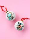 <p>Raise your hand if you have zero skills with a paintbrush. This is the holiday craft for you, then, since all you need to do is stick a temporary tattoo onto an ornament. See how it's done at <a href="https://thecraftedlife.com/temporary-tattoo-ornaments/" rel="nofollow noopener" target="_blank" data-ylk="slk:The Crafted Life;elm:context_link;itc:0;sec:content-canvas" class="link ">The Crafted Life</a>.</p>