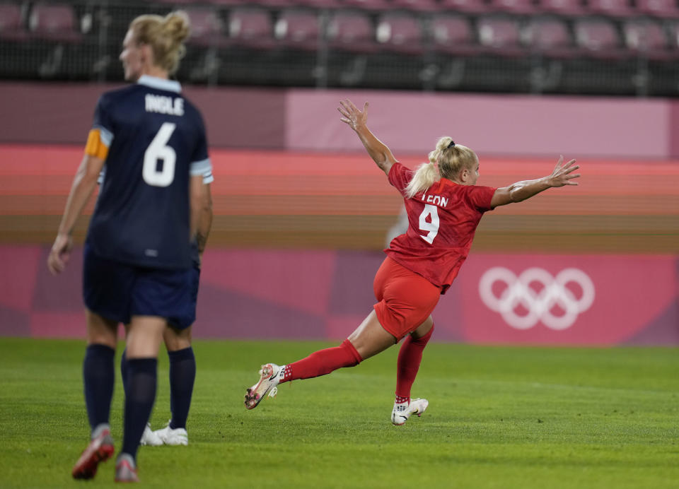 Canada's Adriana Leon, right, celebrates scoring her side's opening goal against Great Britain during a women's soccer match at the 2020 Summer Olympics, Tuesday, July 27, 2021, in Kashima, Japan. (AP Photo/Fernando Vergara)