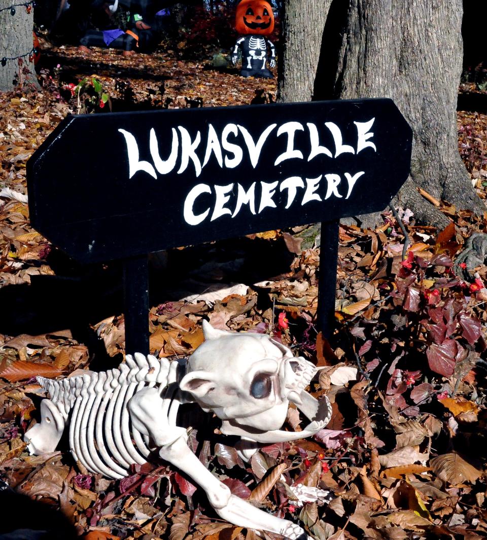 This dog stands guard to the entrance of the Lukasville Cemetery.