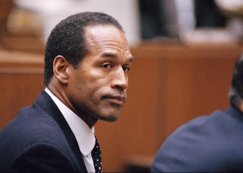 O.J. Simpson sits at his arraignment in superior Court in Los Angeles, July 22, 1994, where he pleaded "absolutely, 100 percent not guilty" on murder charges. (AP Photo/Pool/Lois Bernstein)