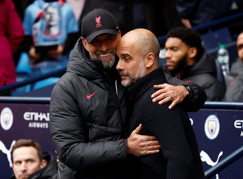 Manchester City manager Pep Guardiola gets a warm welcome from his Liverpool counterpart Jurgen Klopp, who wants to make life ‘really uncomfortable’ for the champions on Saturday afternoon  (Action Images/Reuters)