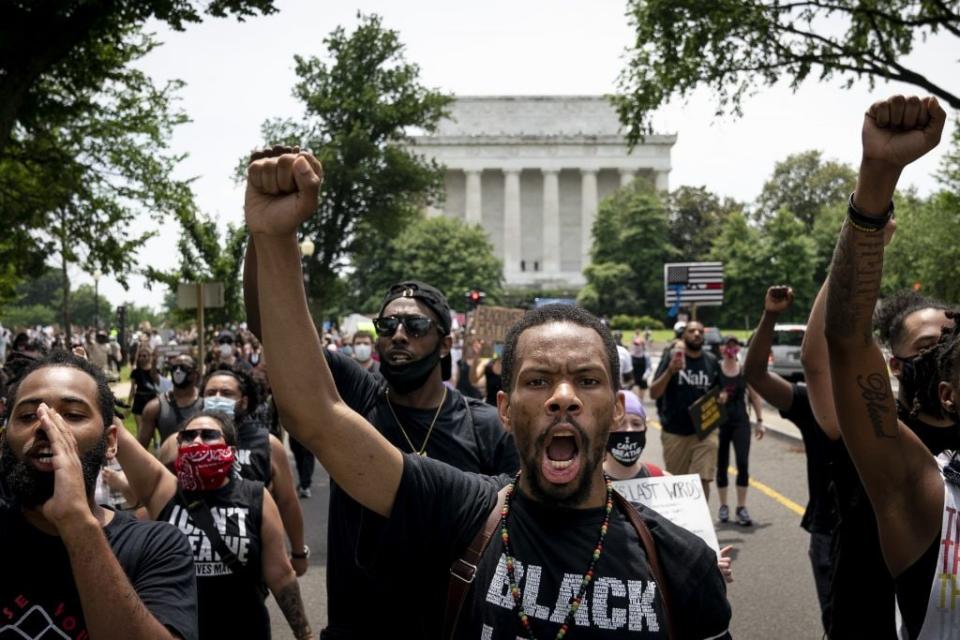 Demonstrators march away from the Lincoln Memorial while protesting against police brutality and racism on June 6, 2020 in Washington, DC. (Photo by Drew Angerer/Getty Images)