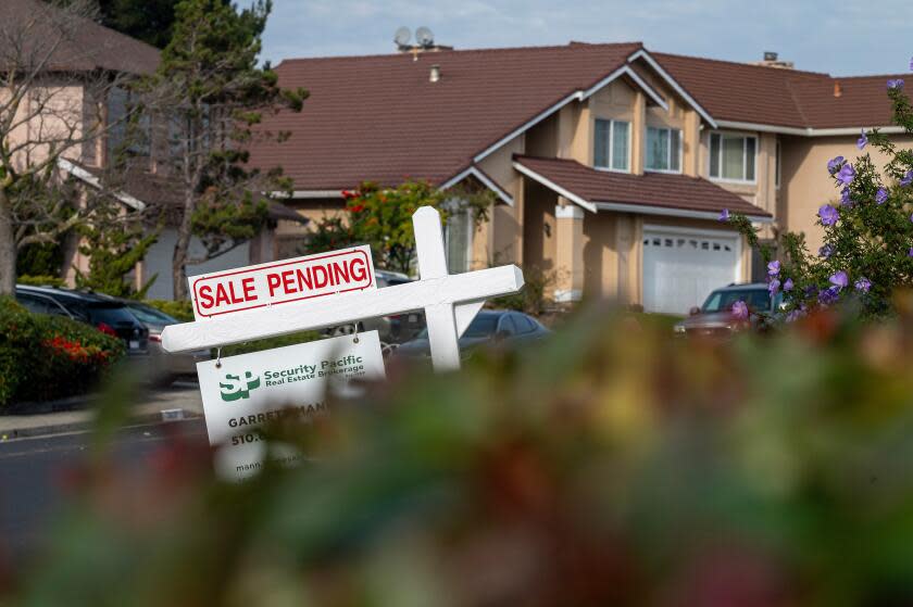 A "Sale Pending" sign in front of a home in Pinole, California, US, on Tuesday, Dec. 26, 2023. Sales of previously owned US homes unexpectedly rose in November, led by a pickup in the South and representing a respite in a two-year downturn caused by higher borrowing costs and a lack of inventory. Photographer: David Paul Morris/Bloomberg via Getty Images