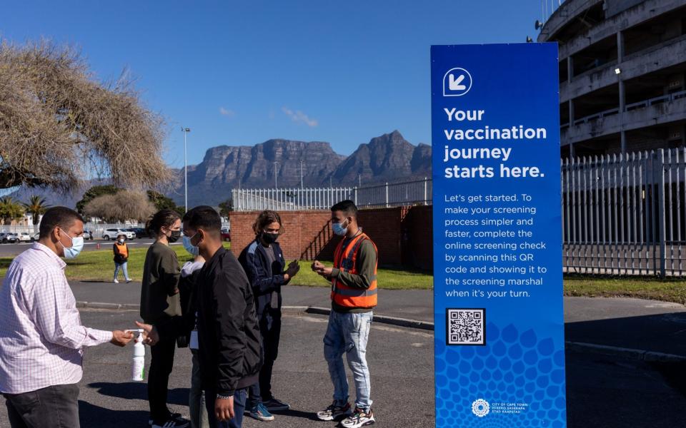 People arrive at a mass vaccination centre in Cape Town, South Africa on 20 August 2021 - Dwayne Senior/Bloomberg