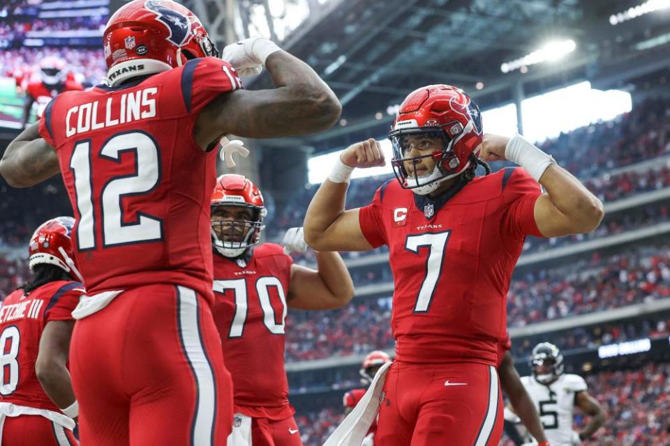 Houston Texans quarterback CJ Stroud, right, celebrates with wide receiver Nico Collins after scoring a touchdown during the fourth quarter against the Jacksonville Jaguars at NRG Stadium on Sunday.