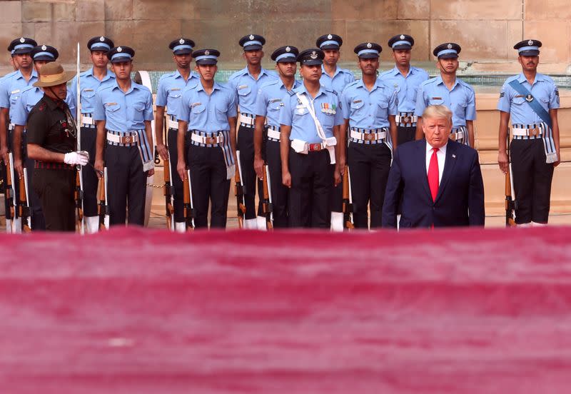 U.S. President Donald Trump walks after inspecting guard of honour during his ceremonial reception at the forecourt of India's Rashtrapati Bhavan Presidential Palace in New Delhi