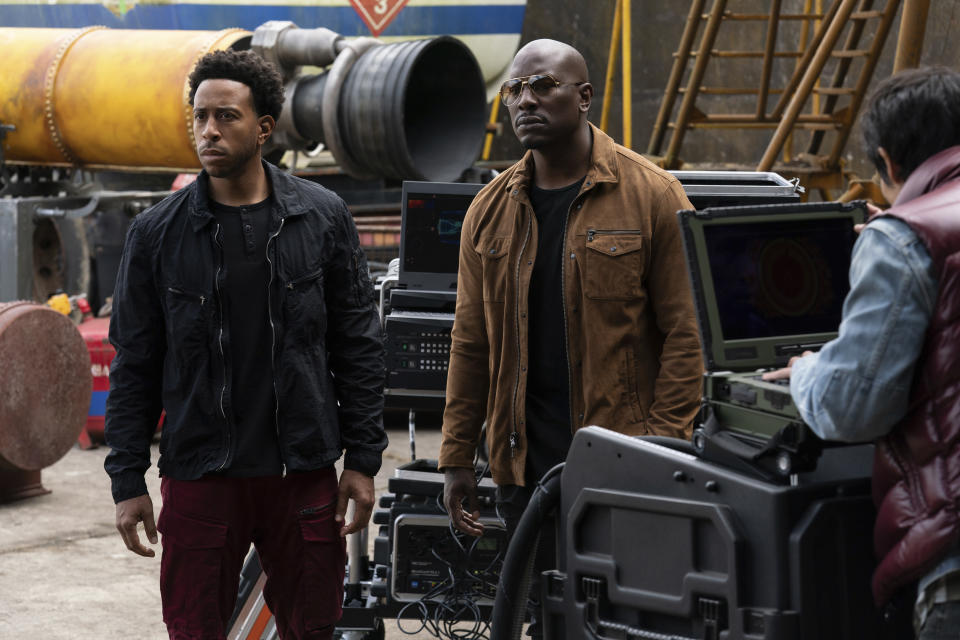 This image released by Universal Pictures shows Chris "Ludacris" Bridges, left, and Tyrese Gibson in a scene from "F9: The Fast Saga." (Giles Keyte/Universal Pictures via AP)