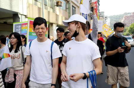 Leong Guzifer (L), 30, and Ting Tseyen, 27, take part in a rally to support the upcoming same-sex marriage referendum, in Kaohsiung, Taiwan, November 18, 2018. REUTERS/Ann Wang