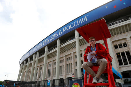 Soccer Football - World Cup - Group A - Russia vs Saudi Arabia - Luzhniki Stadium, Moscow, Russia - June 14, 2018 A volunteer outside the stadium before the match REUTERS/Kai Pfaffenbach