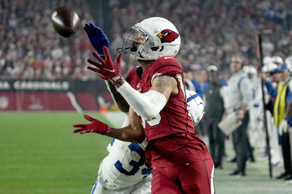 Arizona Cardinals wide receiver Antoine Wesley pulls in a touchdown pass as Indianapolis Colts cornerback Isaiah Rodgers, rear, defends during the second half of an NFL football game, Saturday, Dec. 25, 2021, in Glendale, Ariz. (AP Photo/Rick Scuteri)