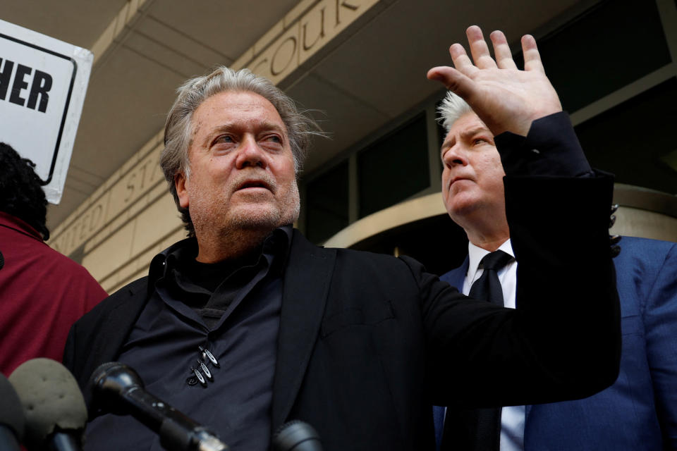 Steve Bannon waves to supporters outside the courthouse in Washington, D.C.