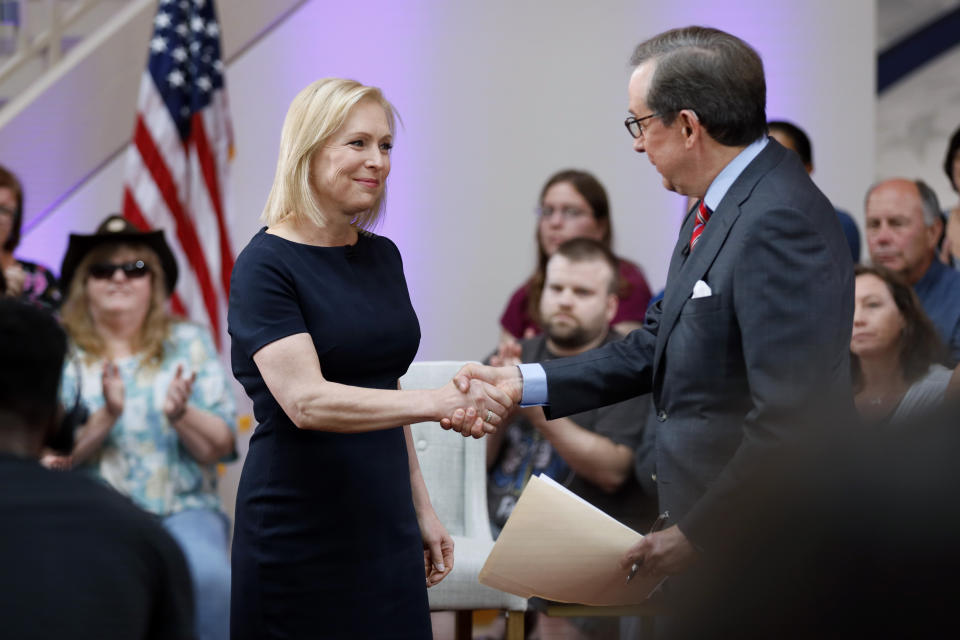 Democratic presidential candidate Sen. Kirsten Gillibrand greets FOX News Anchor Chris Wallace, right, as she arrives at a FOX News town hall, Sunday, June 2, 2019, in Dubuque, Iowa. (AP Photo/Charlie Neibergall)