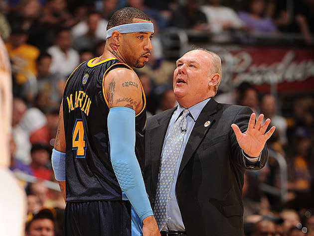 Kenyon Martin and George Karl chat it up. (Getty Images)