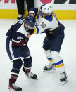 St. Louis Blues center Brayden Schenn, right, connects with a punch while fighting with Colorado Avalanche center Nazem Kadri in the first period of an NHL hockey game Saturday, Oct. 16, 2021, in Denver. (AP Photo/David Zalubowski)