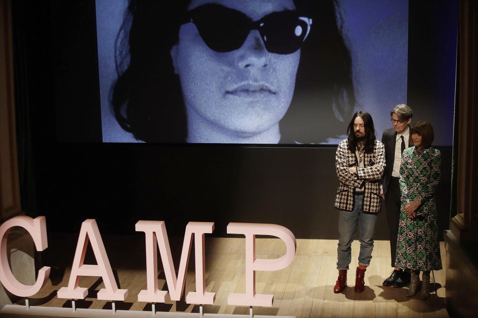 American Vogue editor-in-chief Anna Wintour, right, Gucci creative director Alessandro Michele, left, and curator Andrew Bolton stand during the presentation of this year's Costume Institute exhibition titled ''Camp: Notes on Fashion,'' at the Teatro Gerolamo, in Milan, Italy, Friday, Feb. 22, 2019. The exhibition will be shown at the Metropolitan Museum of Art of New York, from May 9-Sept. 8, 2019. (AP Photo/Luca Bruno)