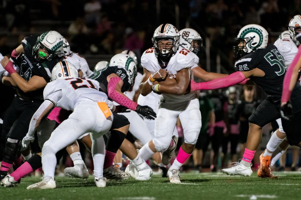 Pennsbury running back Jordan Czerniak runs down the middle in a football game against Pennridge, on Friday, October 6, 2023, at Pennridge High School in Perkasie. The Rams edged the Falcons 15-14.