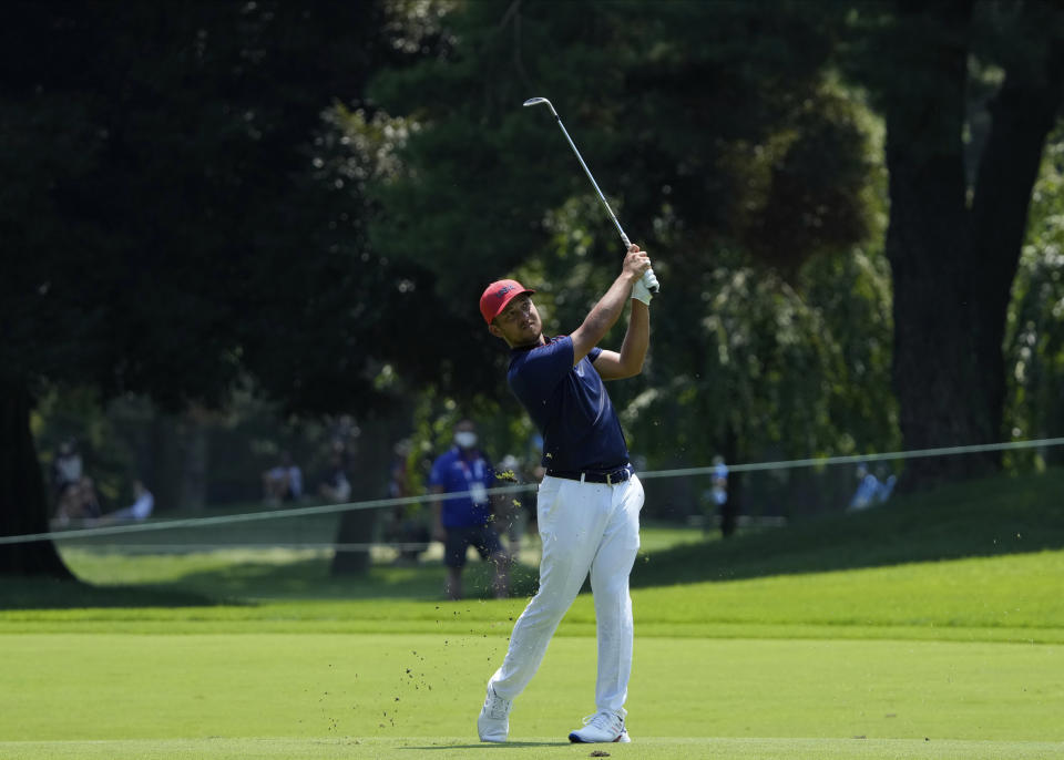 CORRECTS LAST NAME TO SCHAUFFELE FROM SHAUFFELE - Xander Schauffele of the United States watches his shot from the 7th fairway during the final round of the men's golf event at the 2020 Summer Olympics on Sunday, Aug. 1, 2021, in Kawagoe, Japan. (AP Photo/Andy Wong)