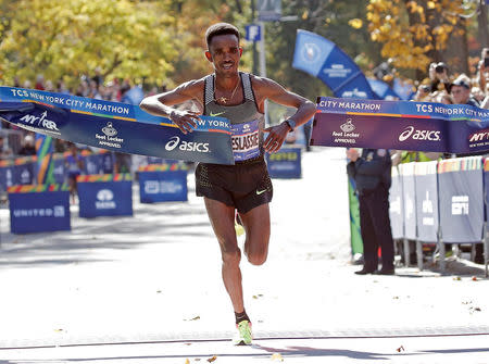 Ghirmay Ghebreslassie of Eritrea crosses the finish line to win the men's field of the 2016 New York City Marathon in Central Park in the Manhattan borough of New York City, New York, U.S. November 6, 2016. REUTERS/Mike Segar