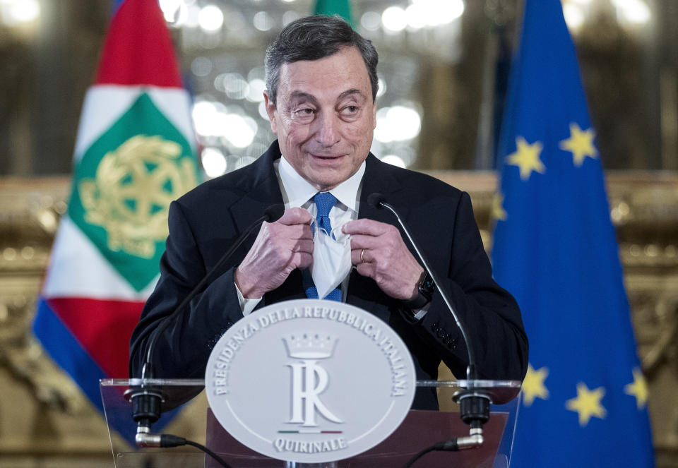 Former European Central Bank president Mario Draghi speaks to the media after accepting a mandate to form Italy's new government from Italian President Sergio Mattarella at the Rome's Quirinale Presidential Palace, Wednesday Feb. 3, 2021. (Roberto Monaldo/LaPresse via AP)