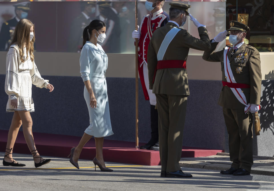 MADRID, SPAIN - OCTOBER 12: The Infanta Sofia, Queen Letizia of Spain and King Felipe VI of Spain salute a major general after the solemn act of homage to the national flag and military parade on Columbus Day on October 12, 2021 in Madrid, Spain. The improvement of the health situation has allowed the traditional parade for the 12th of October, which last year had to be replaced by an austere static act in the courtyard of the Royal Palace, with no public and a reduced participation of military units. A total of 2,656 military personnel, 68 aircraft including planes and helicopters and 115 vehicles are taking part in this year's parade. (Photo By Eduardo Parra/Europa Press via Getty Images)