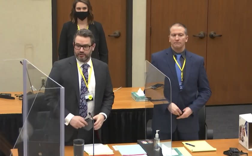 In this image taken from video, defense attorney Eric Nelson, left, and defendant former Minneapolis police officer Derek Chauvin, right, and Nelson's assistant Amy Voss, back, introduce themselves to potential jurors as Hennepin County Judge Peter Cahill presides, prior to continuing jury selection, Monday, March 15, 2021, in the trial of Chauvin, at the Hennepin County Courthouse in Minneapolis, Minn. Chauvin is charged in the May 25, 2020, death of George Floyd. (Court TV, Pool via AP)