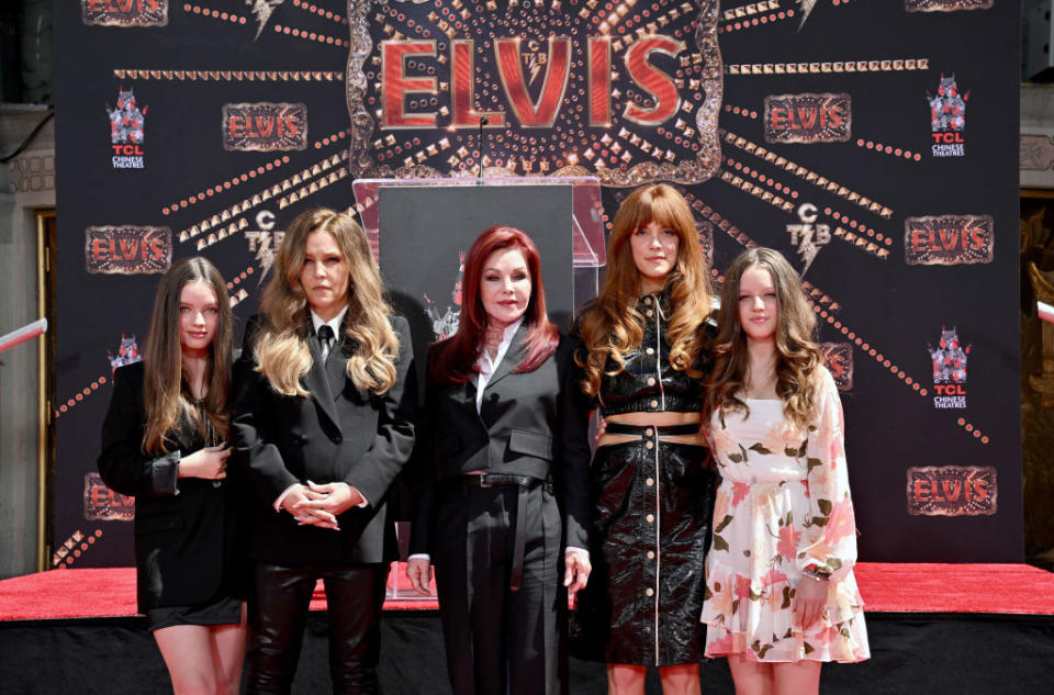 HOLLYWOOD, CALIFORNIA - JUNE 21: (L-R) Harper Vivienne Ann Lockwood, Lisa Marie Presley, Priscilla Presley, Riley Keough, and Finley Aaron Love Lockwood attend the Handprint Ceremony honoring Three Generations of Presley's at TCL Chinese Theatre on June 21, 2022 in Hollywood, California. (Photo by Axelle/Bauer-Griffin/FilmMagic)