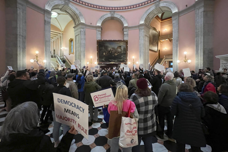 FILE - Protesters gather inside the Ohio Statehouse on May 3, 2023, in Columbus, Ohio, to protest a group of Republican legislators' attempt to make it harder to pass constitutional amendments. A ballot question seeking to make it more difficult to amend the Ohio Constitution was cleared for an August ballot on Thursday, May 18, and teams of Republican and Democratic lawmakers assigned to write pro and con arguments, respectively, to be presented to voters. (AP Photo/Patrick Orsagos, File)